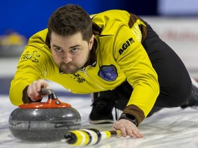 Team Manitoba skip Matt Dunstone delivers a stone in a game against Nunavut in the Tim Hortons Brier at Budweiser Gardens in London on Sunday, March 5, 2023. (Mike Hensen/The London Free Press)