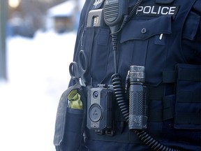 Calgary police with body cameras check out a possible shooting in N.W. Calgary on Tuesday, March 14, 2023.