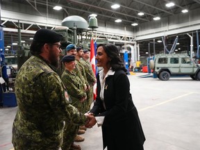 Defence Minister Anita Anand greets Canadian Forces personnel at CFB Kingston, in Kingston, Ont., Tuesday, March 7, 2023.