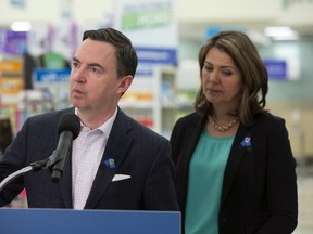 Health Minister Jason Copping, left, and Premier Danielle Smith provide an update on the government’s efforts to import children’s pain and fever medications on March 20, 2023.
