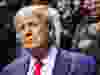 Former U.S. president Donald Trump greets fans as he arrives before the finals of the NCAA Division I Wrestling Championships at BOK Center in Tulsa, Okla, March 18, 2023.