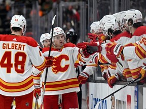 Calgary Flames defenceman Troy Stecher celebrates with teammates after scoring against the Anaheim Ducks at Honda Center in Anaheim on Tuesday, March 21, 2023.