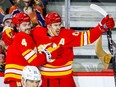 Calgary Flames Mikael Backlund celebrates with teammate Rasmus Andersson after scoring against the Edmonton Oilers in NHL hockey at the Scotiabank Saddledome in Calgary on Tuesday, December 27, 2022.