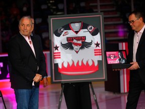Bret Hitman Hart is honoured as a Forever a Hitmen with a banner raising ceremony with family before the Calgary Hitmen played the Red Deer Rebels in WHL action at the Scotiabank Saddledome in Calgary during the 3rd annual Bret Hitman Hart game on Saturday, March 11, 2023. Darren Makowichuk/Postmedia