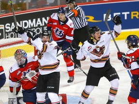 The Calgary Hitmen celebrate a goal by forward Matteo Danis against Lethbridge Hurricanes goalie Bryan Thomson at Scotiabank Saddledome in Calgary on Wednesday, March 15, 2023.