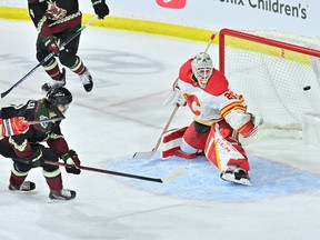 Arizona Coyotes right wing Clayton Keller scores on Calgary Flames goaltender Jacob Markstrom in the first period at Mullett Arena.