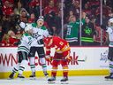 March 18, 2023;  Calgary, Alberta, Canada;  Dallas Stars left winger Jason Robertson, 21, celebrates with teammates after scoring a goal against the Calgary Flames in overtime at the Scotiabank Saddledome.  Compulsory loan: Sergey Belsky-USA TODAY Sports