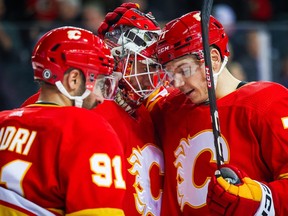 Mar 28, 2023; Calgary, Alberta, CAN; Calgary Flames goaltender Jacob Markstrom (25) and Calgary Flames right wing Walker Duehr (71) celebrates win over Los Angeles Kings at Scotiabank Saddledome. Mandatory Credit: Sergei Belski-USA TODAY Sports