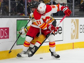 Calgary Flames defenseman Troy Stecher tests Vegas Golden Knights forward Pavel Dorofeev without a puck at the T-Mobile Arena in Las Vegas on Thursday, March 16, 2023.