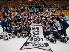 The Mount Royal University Cougars celebrate their U SPORTS women’s hockey championship in Montreal on Sunday, March 19, 2023.