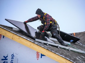 SkyFire Energy workers install solar panels on a home in the southwest  Calgary community of Belmont in this photo from Feb. 2.