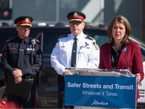Premier Danielle Smith speaks during a press conference announcing measures to tackle the rising violent crimes in Calgary and Edmonton outside the Sunalta CTrain station in Calgary on Tuesday.