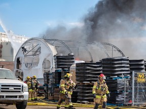 Calgary Fire Department is extinguishing a fire at an auto recycling plant in Southeast Calgary on Tuesday, April 11, 2023. Azin Ghaffari/Postmedia