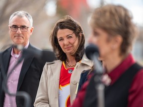 Premier Danielle Smith watches as Mayor Jyoti Gondek speaks at a press conference making an announcement about a future Event Centre in Calgary on Tuesday, April 25.