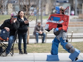 A cosplayer walks to the starting point of the Calgary Expo Parade of Wonders on Friday.