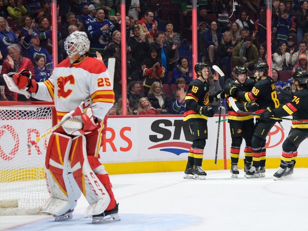 Weegar gets 1st goal with Flames in 3-2 win over Canucks