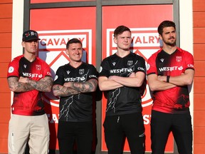 Cavalry FC players (L-R) Myer Bevan, Fraser Aird, Gareth Smith-Doyle and Charlie Trafford pose wearing the CPL team's new 2023 kit unveiled at Kildares Ale House in Calgary on Wednesday, April 5, 2023. Jim Wells/Postmedia