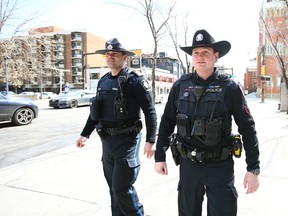 Calgary Police Service Sgt. Mike Anderson and Acting Sgt. Eric LeGreeley (Sheriff's office) on Wednesday, April 12, 2023 walk a beat near the Sheldon Chumir Centre in downtown Calgary.