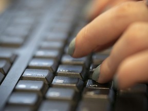 A woman types on a keyboard in New York,&ampnbsp;Oct. 8, 2019. The European Union's head of combatting foreign interference in communications says Canadians can use explosive allegations about Beijing's meddling in elections as an opportunity to improve the public's understanding of disinformation.
