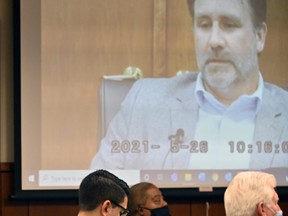 Video testimony of former Louisville Police officer Myles Cosgrove is played during Brett Hankison's trial Tuesday, March 1, 2022, in Louisville, Ky.