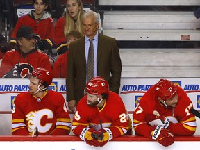 The Calgary Flames bench absorbs a 3-1 loss to the Anaheim Ducks on March 10.