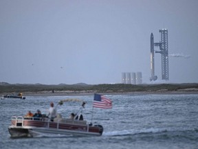 The SpaceX Starship rocket stands on the launchpad ahead of its scheduled launch from the SpaceX Starbase in Boca Chica as seen from South Padre Island, Texas, Monday, April 17, 2023.