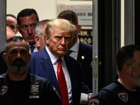Former U.S. President Donald Trump makes his way inside the Manhattan Criminal Courthouse in New York on April 4, 2023.