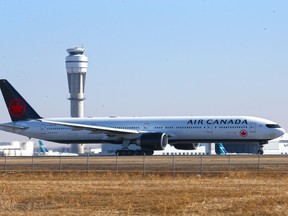 An Air Canada Boeing 777 takes off at the Calgary International Airport on Tuesday, March 23, 2021.