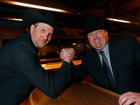 Drivers Kurt Bensmiller, left, and Kris Molle both collected $170,000 during the Calgary Stampede Canvas Auction at the Big Four Roadhouse in Calgary on Thursday, April 13, 2023.