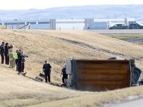 Calgary police investigate a fatal vehicle collision on the off ramp from Deerfoot Trail onto Stoney Trail in Calgary on Thursday, April 27.
