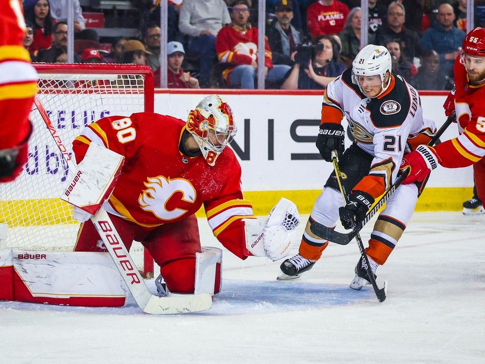 Calgary Flames goaltender Dan Vladar makes a save against Anaheim Ducks forward Isac Lundestrom at the Scotiabank Saddledome in Calgary on Sunday, April 2, 2023.