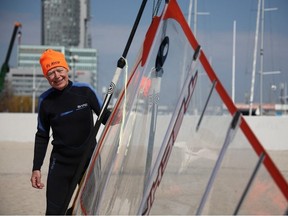 Piotr Dudek, 88, shows his sail before windsurfing in Gdynia, Poland, April 18, 2023.