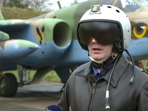 In this handout photo taken from video released by Russian Defense Ministry Press Service on Friday, April 14, 2023, a Belarusian air force pilot speaks at an unidentified location.
