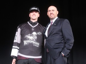 Seth Van Schepen and National Lacrosse League commissioner Brett Frood pose for a photo after the Calgary Roughnecks took the former Oakville Rock star 10th overall in the 2022 NLL Draft.