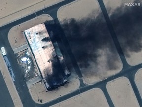 Satellite image shows a closer view of a burning building at the Merowe Airbase, Sudan, April 18, 2023.