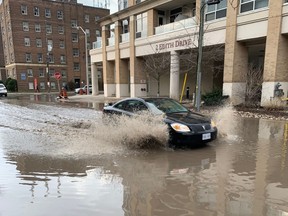 Cars had to motor through water after the downpour formed this small lake near the intersection of Yonge St. And Eglinton Ave. W.