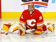 Calgary Flames goaltender Dustin Wolf during warm-up before taking on the San Jose Sharks at the Scotiabank Saddledome in Calgary on Wednesday, April 12, 2023.