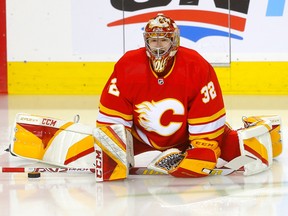 Calgary Flames goaltender Dustin Wolf during warmups before taking on the San Jose Sharks at the Scotiabank Saddledome in Calgary on Wednesday, April 12, 2023.