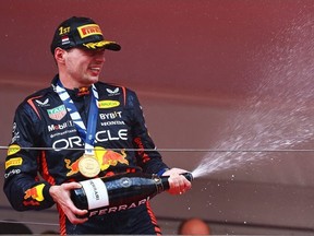 Race winner Max Verstappen of the Netherlands and Oracle Red Bull Racing celebrates on the podium during the F1 Grand Prix of Monaco at Circuit de Monaco on May 28, 2023 in Monte-Carlo, Monaco.