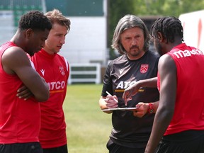 Cavalry FC coach/GM Tommy Wheeldon Jr talks to players during practice on ATCO Field at Spruce Meadows on Friday, May 19, 2023.