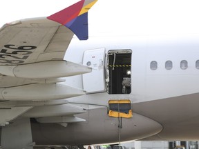 An Asiana Airlines plane is parked after a passenger opened a door in air at Daegu International Airport in Daegu, South Korea, Friday, May 26, 2023.