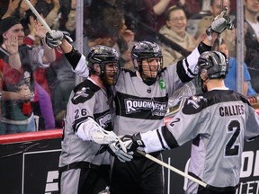 The Calgary Roughnecks celebrate a goal against the Colorado Mammoth at the Scotiabank Saddledome.
