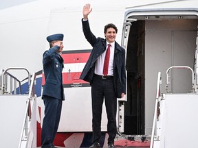 Prime Minister Justin Trudeau (R) arrives at Hiroshima airport in Mihara, Hiroshima prefecture on May 18, 2023, to attend the G7 Leaders' Summit.