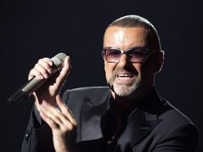 British singer George Michael performs on stage during a charity gala for the benefit of Sidaction, at the Opera Garnier in Paris on September 9, 2012.