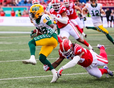 Calgary Stampeders defensive back Michael Griffin reaches out to grab Edmonton Elks wide receiver CJ Sims at McMahon Stadium in Calgary on Monday, May 22, 2023.  
Gavin Young/Postmedia