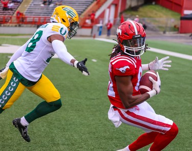 Calgary Stampeders wide receiver Luther Hakunavanhu scores a touchdown against the Edmonton Elks during preseason CFL action at McMahon Stadium in Calgary on Monday, May 22, 2023.  
Gavin Young/Postmedia
