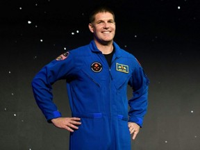 Canadian astronaut Jeremy Hansen smiles after being selected for the Artemis II mission during a news conference held by NASA and CSA at NASA Johnson Space Center's Ellington Field in Houston, April 3, 2023.