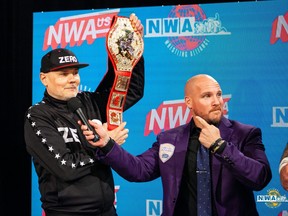 The Smashing Pumpkins frontman Billy Corgan, left, owns the National Wrestling Alliance, once the industry's premier organization. Pictured with him is the NWA's television announcer Kyle Davis.