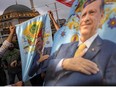 Supporters of Recep Tayyip Erdogan hold flags depicting Turkish President near Taksim Mosque at the Taksim Square in Istanbul on the day of the Presidential runoff vote in Istanbul, on May 28, 2023.