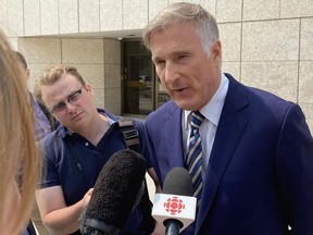 Maxime Bernier, leader of the People's Party of Canada, speaks to reporters in Winnipeg, Tuesday, May 16, 2023, after appearing in court and being fined $2,000 for breaking COVID-19 restrictions in Manitoba in 2021.
